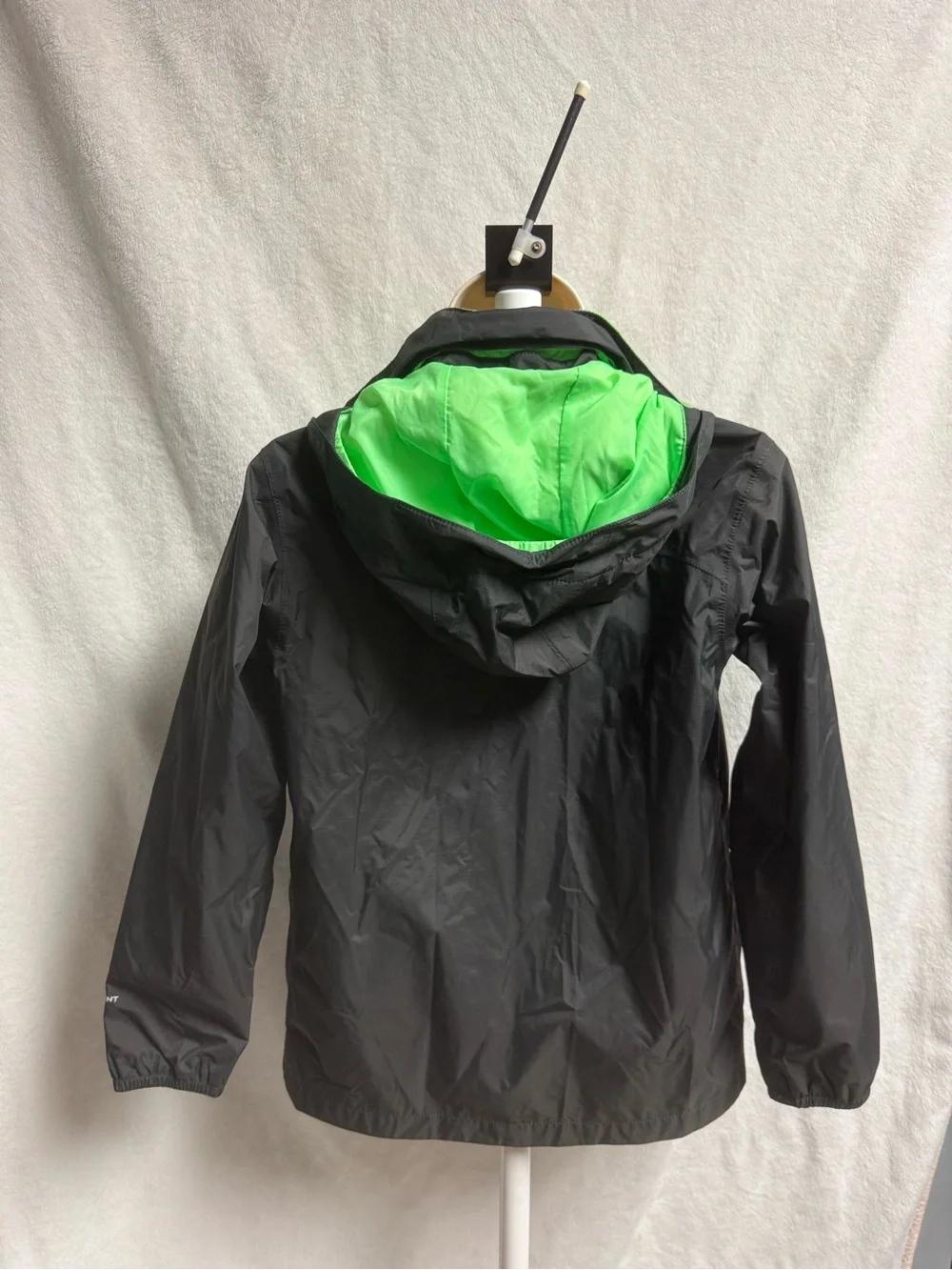The North Face Kids Black Raincoat with Neon Green Lining